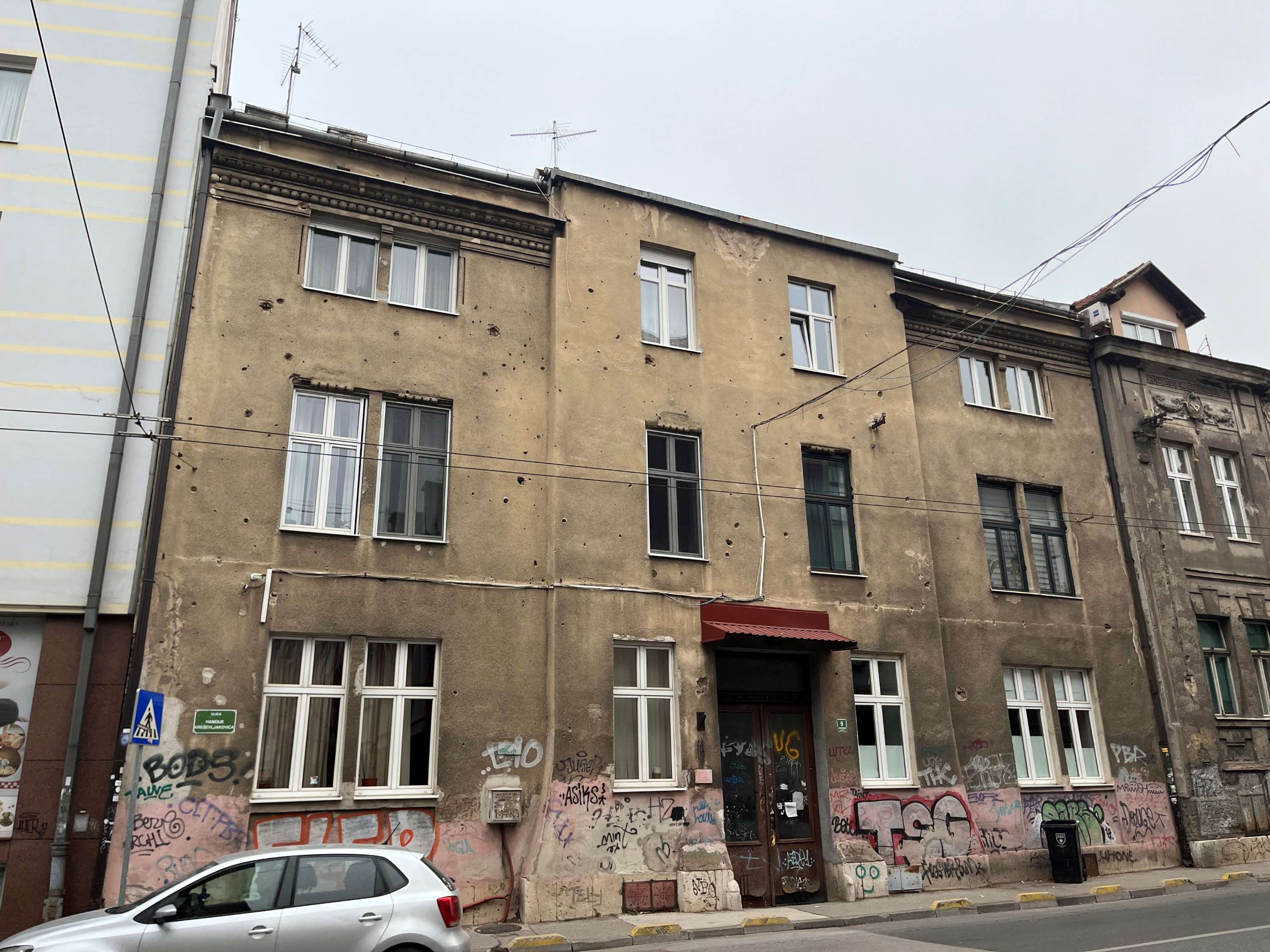 House facade with shrapnel